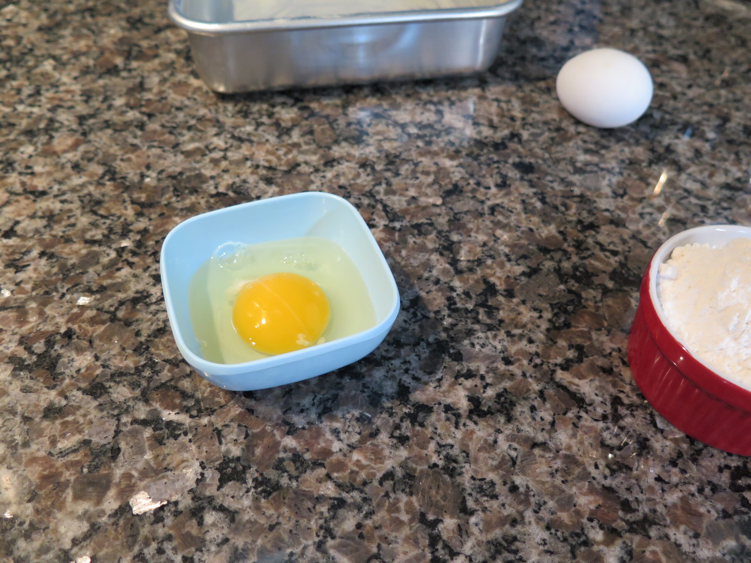 egg cracked into a separate bowl