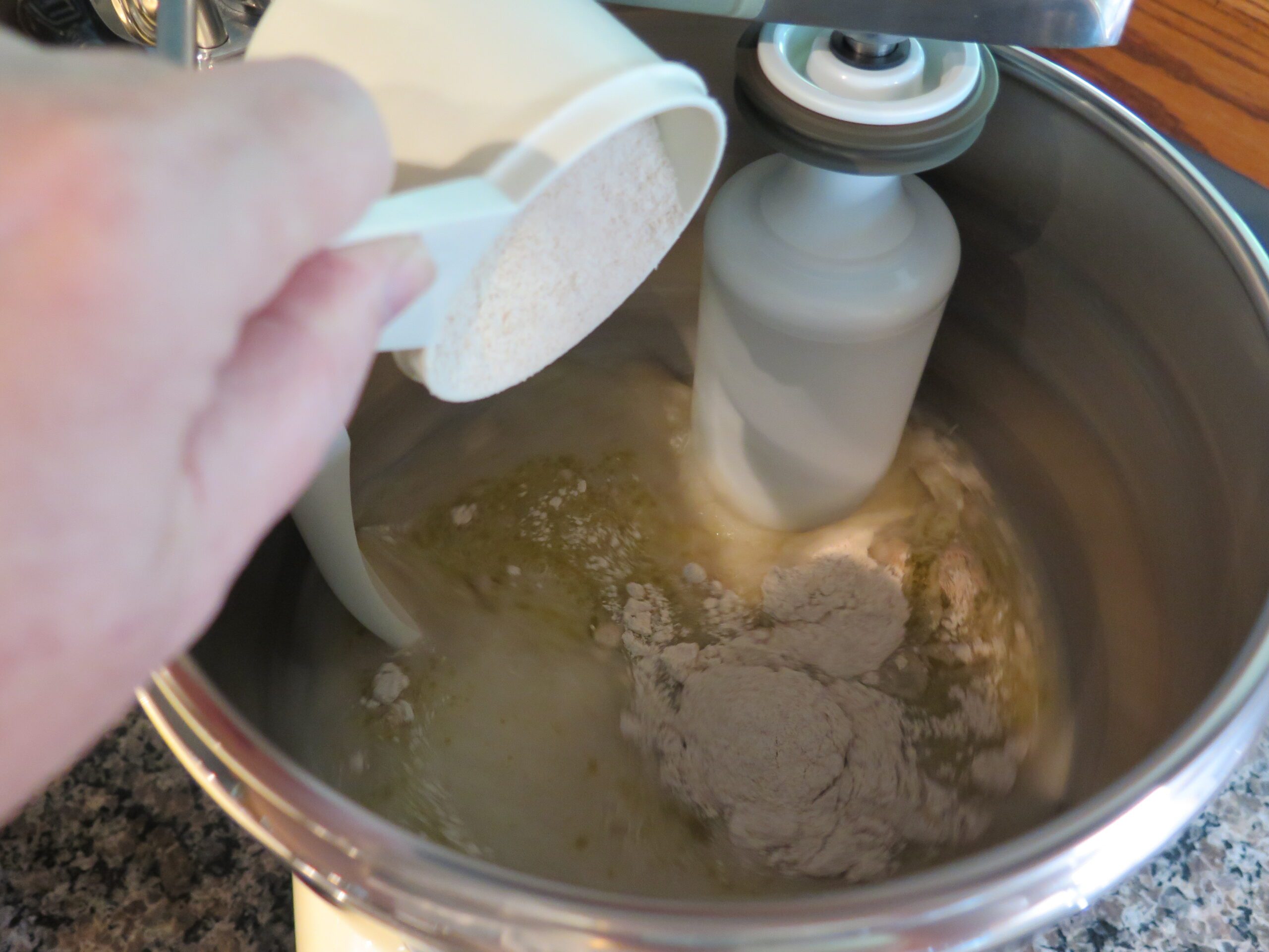 adding flour for bread dough
