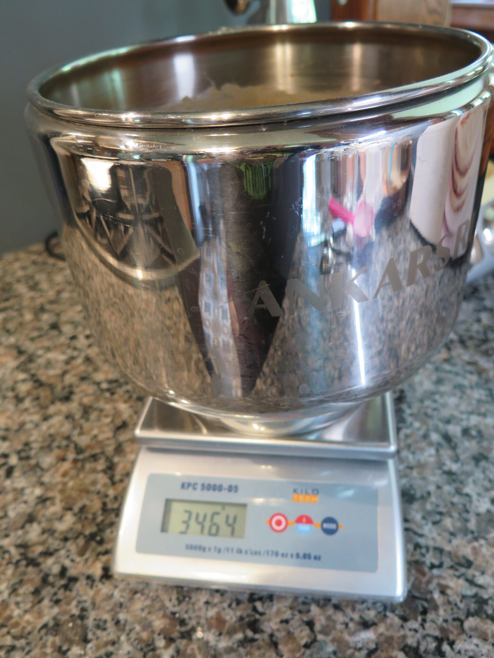 weighing the bowl with the carrot cake mixture