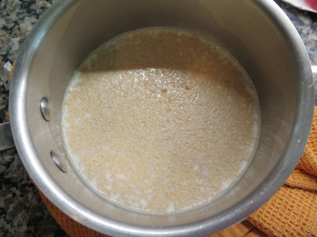 Yeast in milk warmed in a pot