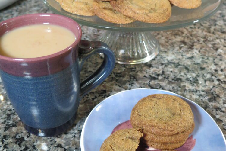 Chewy molasses spice cookies with a cup of tea