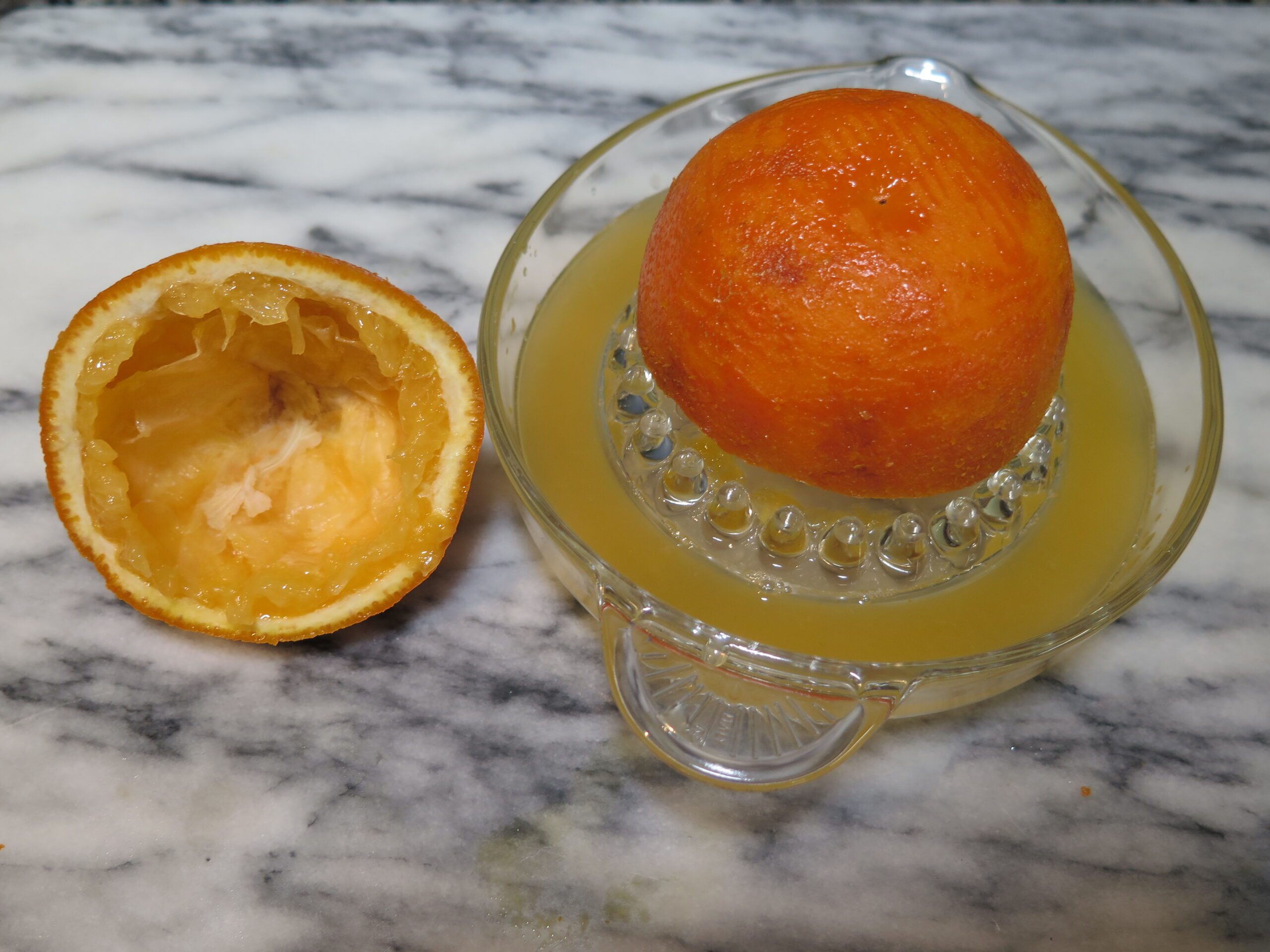 Orange being juiced for recipe