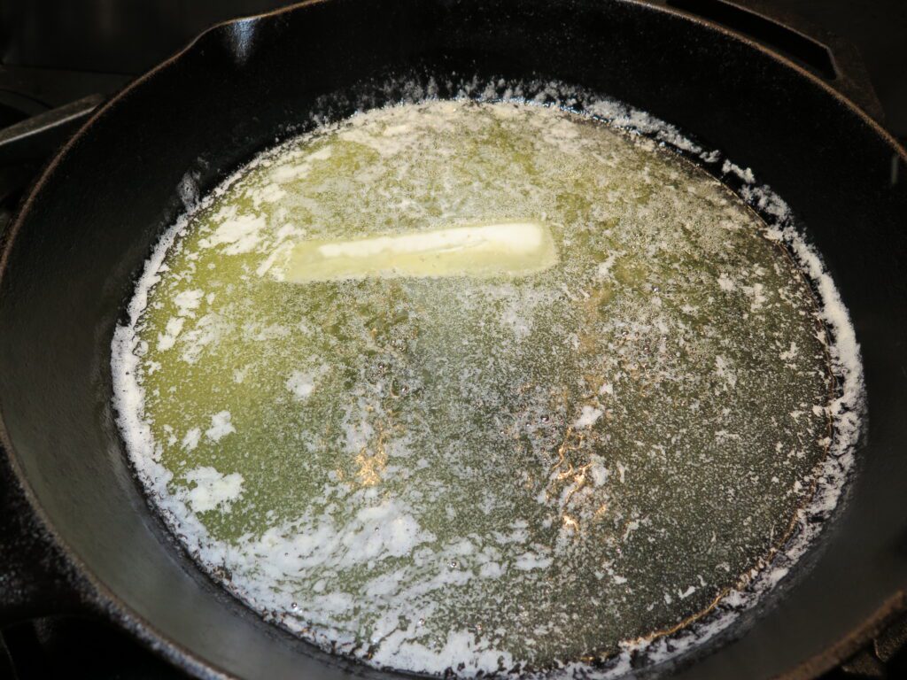 Melt the butter in the cast iron