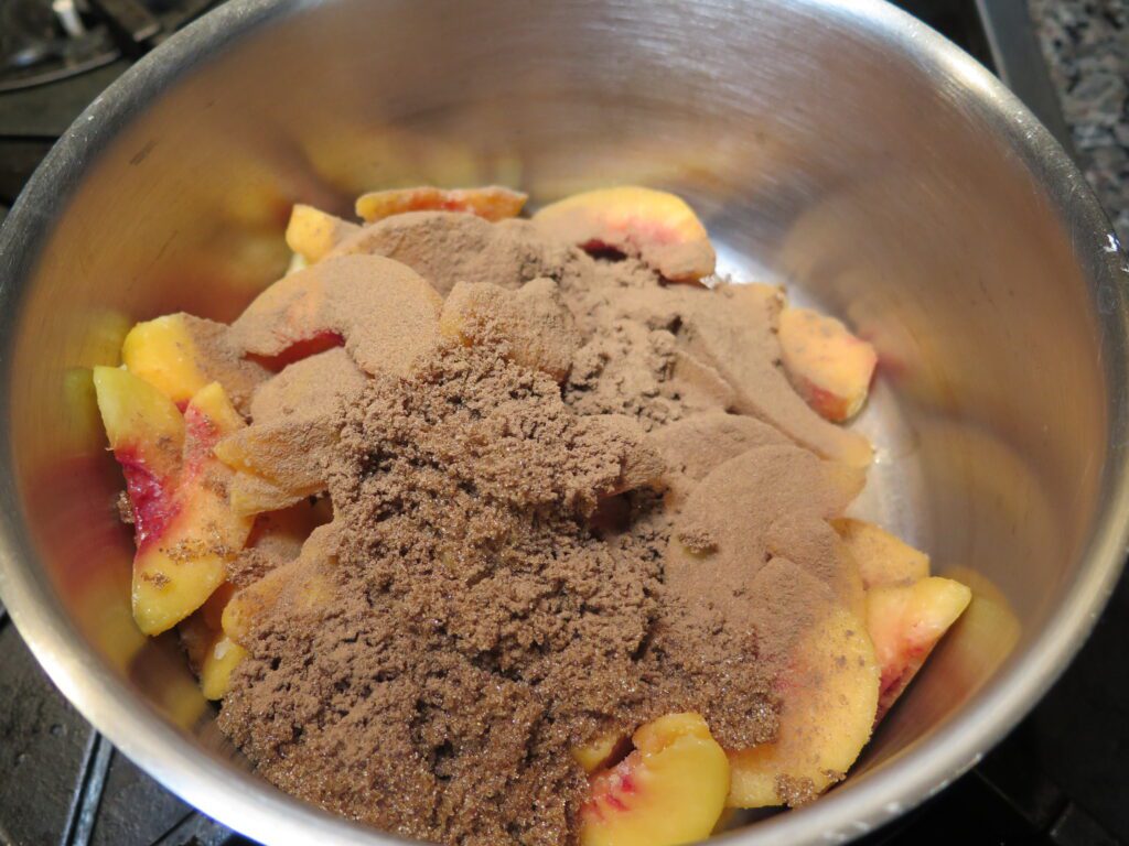 Peaches and brown sugar in a sauce pot