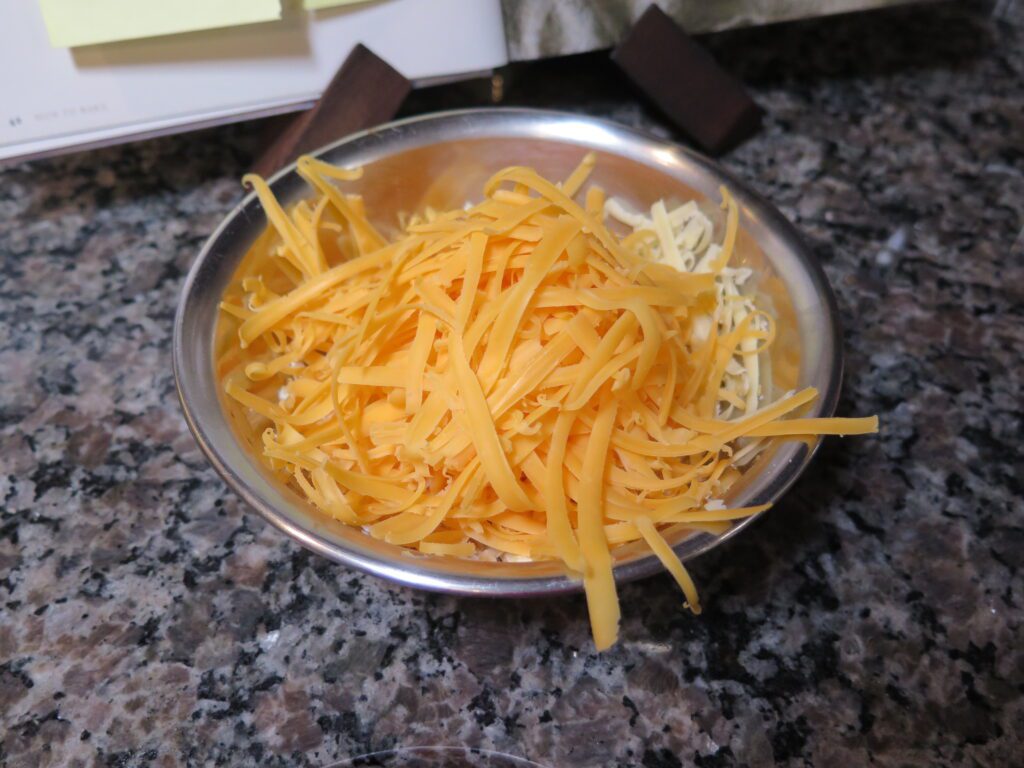 Shred some cheddar cheese